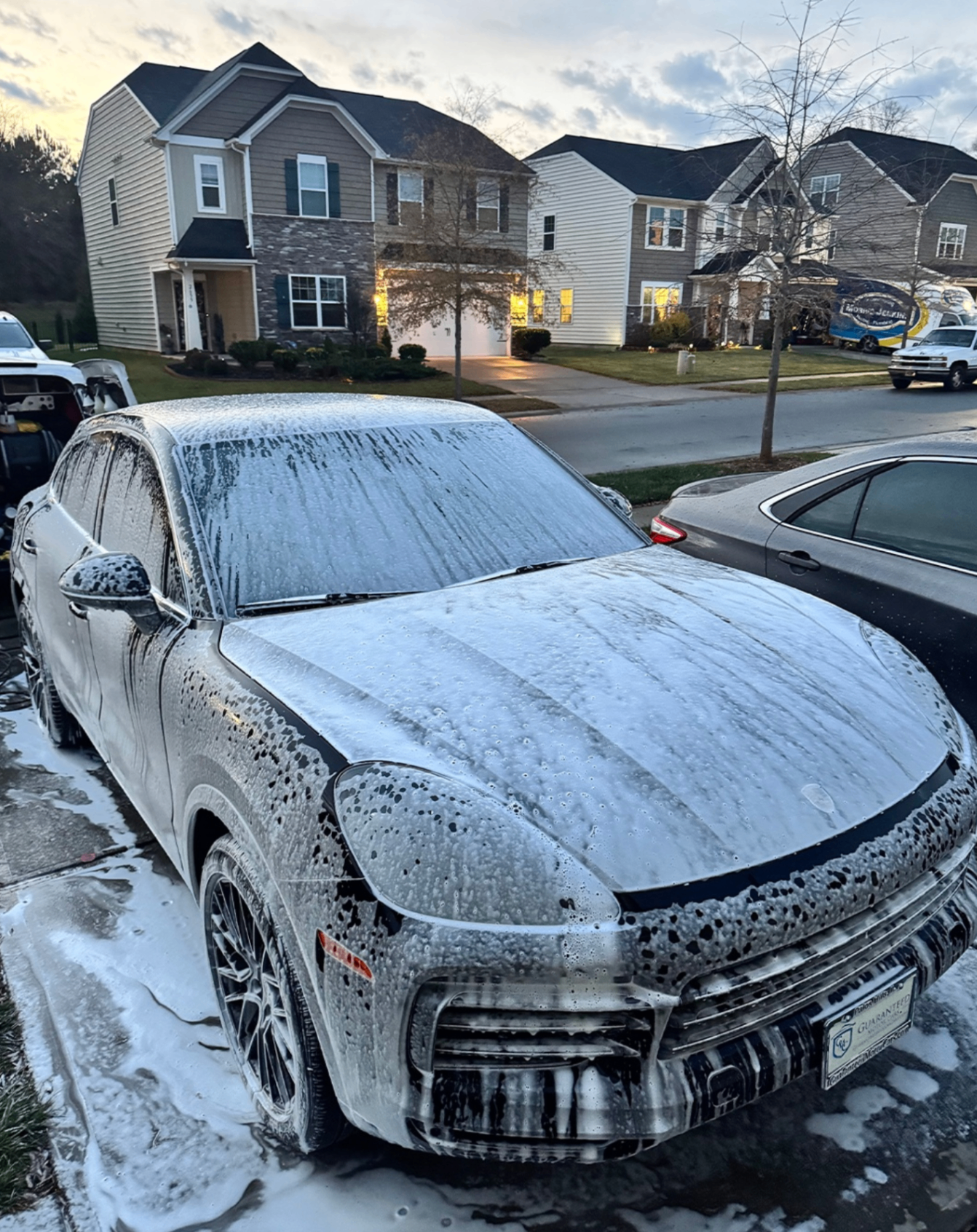 Porsche Cayenne covered in foam during exterior wash